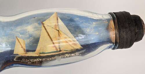 A large folk art diorama double ship in a bottle circa 1920