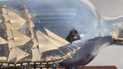 A large folk art diorama double ship in a bottle circa 1920