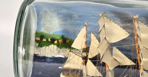 A large folk art diorama double ship in a bottle circa 1920