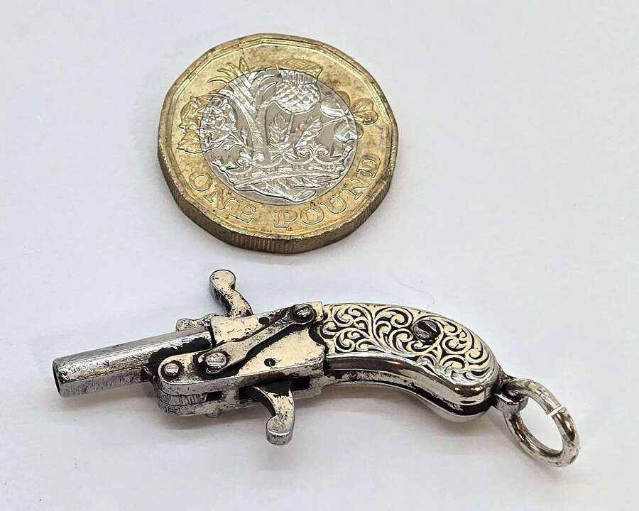 Antique pocket watch chain fob in the form of a flintlock pistol circa 1900
