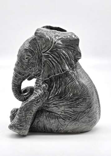 Antique glazed pottery sculpture of a baby elephant made in 1928