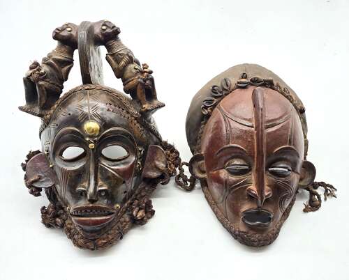 A matched pair of African tribal masks, circa 1930