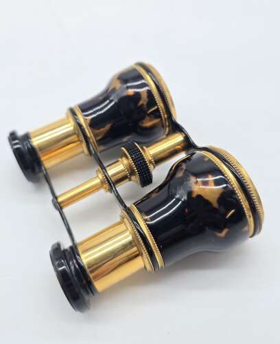 A pair of opera glasses with original case, English circa 1900