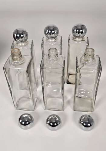 Six spirit decanter set in a leather fitted case used for hunting or shooting, circa 1920