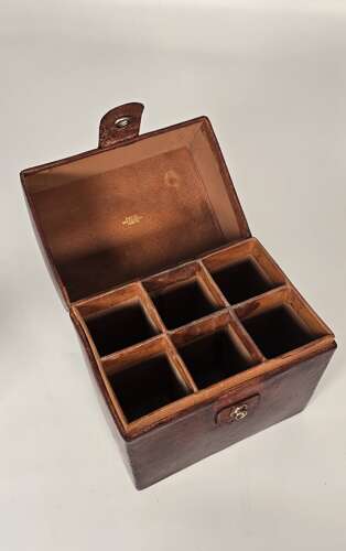 Six spirit decanter set in a leather fitted case used for hunting or shooting, circa 1920