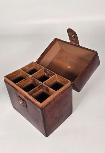 Six spirit decanter set in a leather fitted case used for hunting or shooting, circa 1920