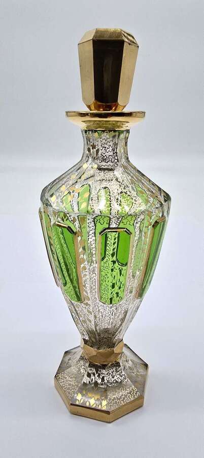 Bohemian glass perfume bottle with a green overlay and gilt decoration circa 1890 circa