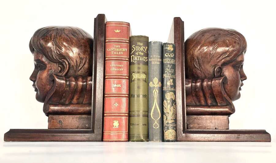 Pair of ecclesiastical choir boy carved mahogany library bookends C1860