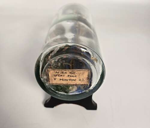 A folk art ship in a bottle diorama dated 1922